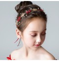 Serre-tête décoré de fleurs rouge et de perles