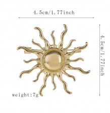 Golden sun brooch